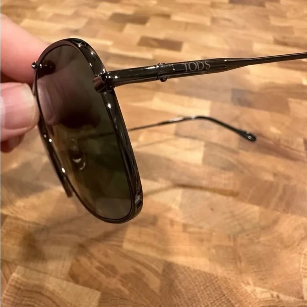Tod's Black Frame Sunglasses with Dark Green Lenses